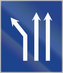 Road sign used in Spain - Fork left on three-lane carriageway