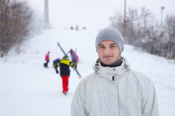 Handsome young man on a ski slope