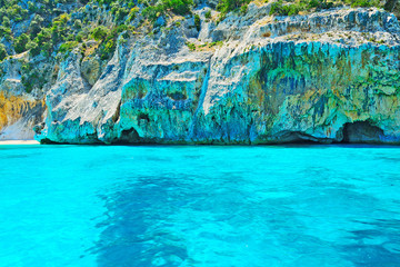 tuquoise water and grey rocks in Orosei Gulf shoreline