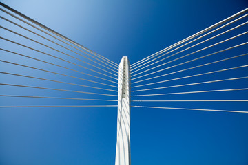 Wonderful white bridge structure over clear blue sky