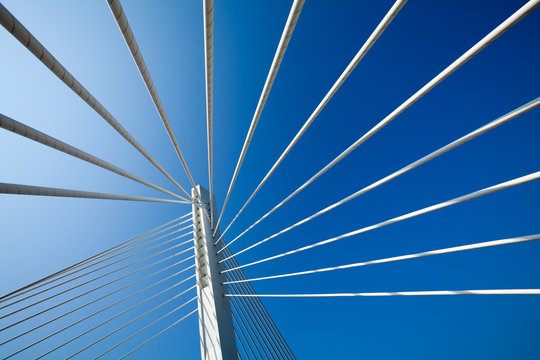 Fototapeta Wonderful white bridge structure over clear blue sky