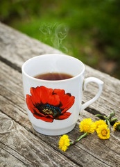 Cup of coffee on wooden table