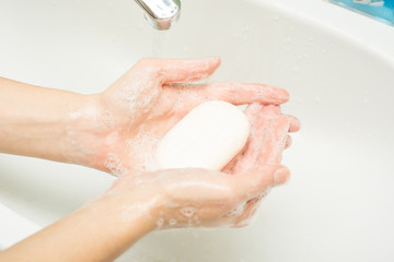Fototapeta premium Hygiene. Cleaning Hands. Washing hands with soap and water.