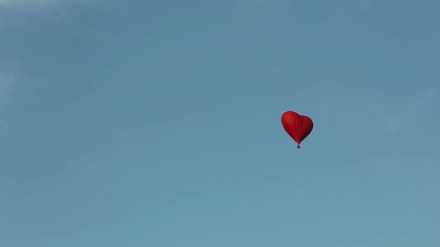 aerostat heart in the blue sky