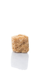 Brown sugarcane sugar cube over white background