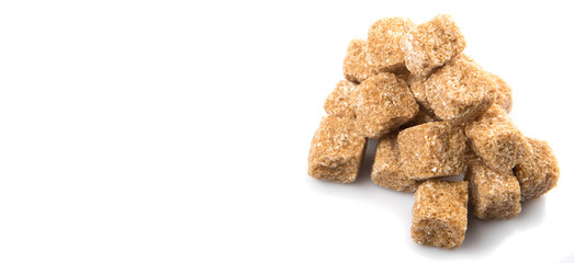 Brown sugarcane sugar cube over white background