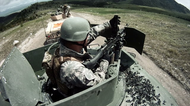 Humvee gunner in military convoy