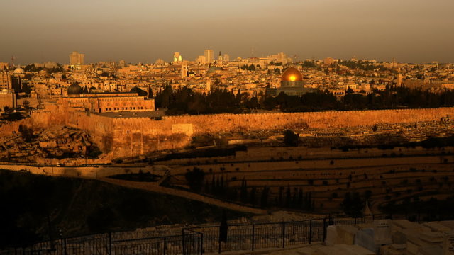 Panning shot of Sunrise time-lapse from the Mount of Olives overlooking the Dome of the Rock.