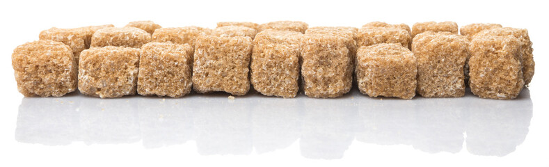 Brown sugarcane sugar cube over white background