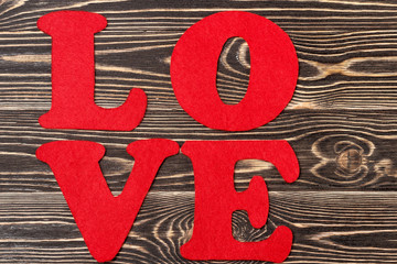 Word Love on wooden background for Valentine's day