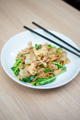 Asian stir fried flat rice noodles. Pad se ew with chicken