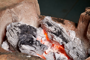 burning charcoal in old stove, thailand tradition