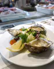 fresh oysters serving with salad