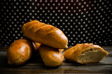 Fresh bread on wooden background
