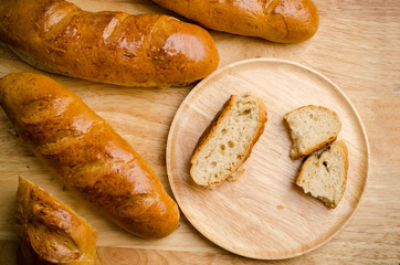 Fresh bread on wooden background