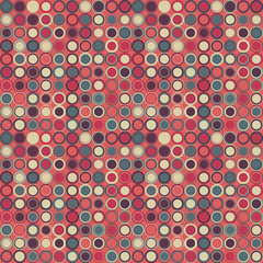 Vector seamless pattern. Consists of geometric elements arranged on red background.The elements have a circular shape and different color.