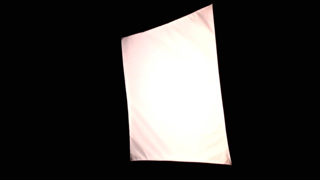 Turning on and off fluorescent lights in professional soft box on the black background or dark room. With diffuser.