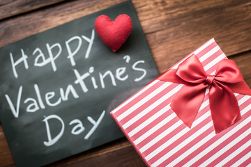 Happy Valentines Day message written on little chalkboard with p