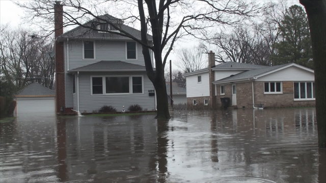 House owner fight with flood due to overflowing Des Plaines River after heavy rainfalls 3. At that time Flood stage in this area was 9.6ft, major flooding stage is 9.0ft.