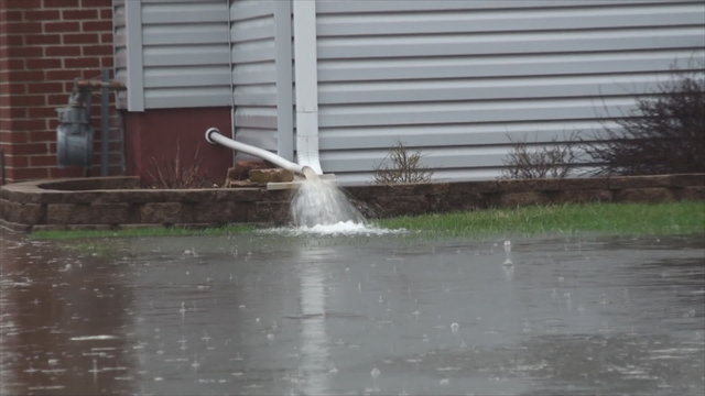 House owner fight with flood due to overflowing Des Plaines River after heavy rainfalls. At that time Flood stage in this area was 9.6ft, major flooding stage is 9.0ft.