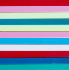 Colorful striped background. Plastique sticks of different color