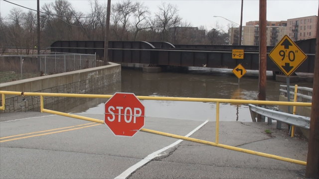 This road closes time to time due to the rising Des Plaines River, but that day major flooding was occurring and water height was almost up to the train bridge.