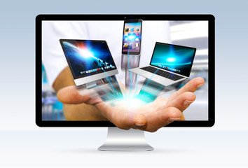 Businessman escaping from computer holding tech device in his ha