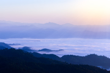 Fototapeta na wymiar Silhouette of Sunrise and mist with mountain at Huai Nam Dang National Park in Chiang Mai and Mae Hong Son, Thailand.
