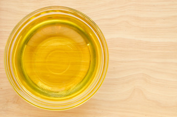 Vegetable oil in glass cup.