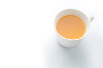 Orange juice on white glass isolated on white background.