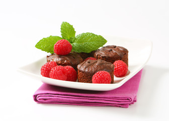 Mini chocolate cakes with fresh raspberries