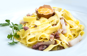 tasty pasta with roast ham on the table