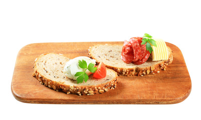 Bread with cheese spread and salami