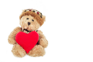 Teddy bear with heart on white background