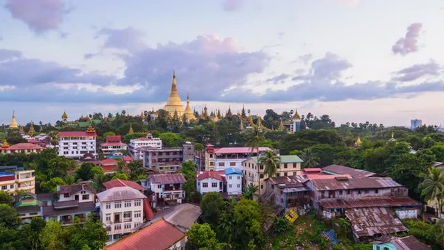 Yangon, Myanmar skyline time lapse over Singuttara Hill and Shwedagon Pagoda.