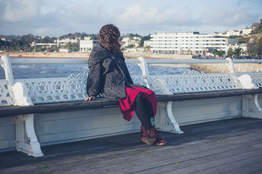 Young woman relaxing on the pier