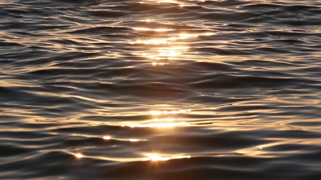 Sun track on lake water surface. Nature sunset background.
