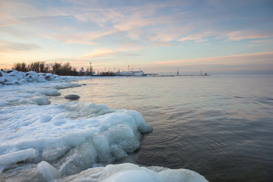 icy coast of Baltic sea, at sunset