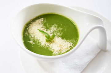 Cream spinach on white plate studio shot