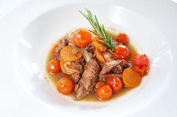 Roast lamb Chops and Vegetables on white plate