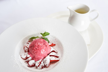 White chocolate soup on white plate studio shot