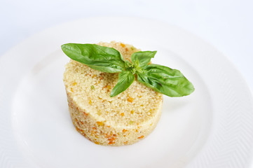 Couscous on white plate studio shot african food
