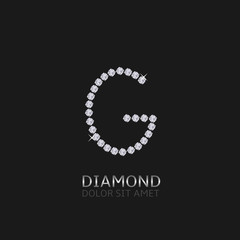 Letter G with gemstones