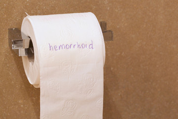 The word haemorrhoid is written on a paper