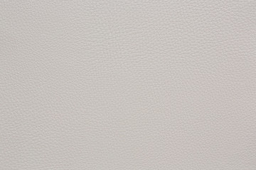 Beige coloured faux leather. Closeup. Background