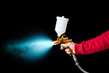 Naklejka premium airbrush paint sprayer isolated on black