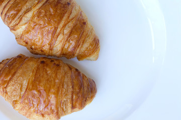 French croissant on a white plate