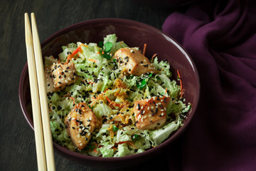 Fresh salad with napa cabbage, carrot, chicken, cilantro and sesame seeds