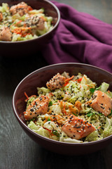 Fresh salad with napa cabbage, carrot, chicken, cilantro and sesame seeds