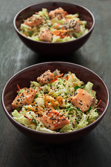 Fresh salad with napa cabbage, carrot, chicken, cilantro and sesame seeds